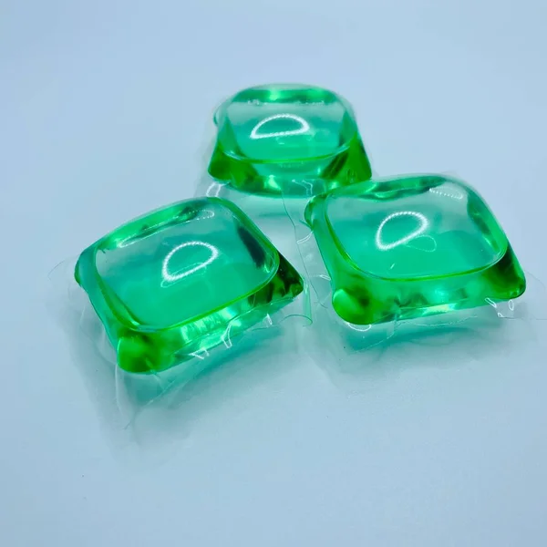 green plastic bottles on a white background