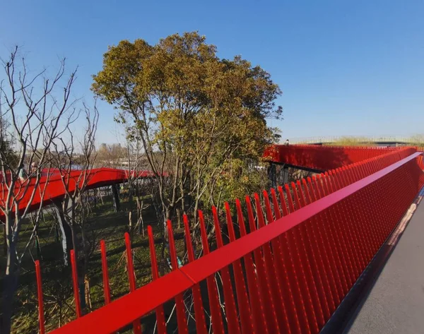 red bridge in the park