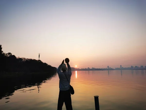 silhouette of a man and woman on the beach