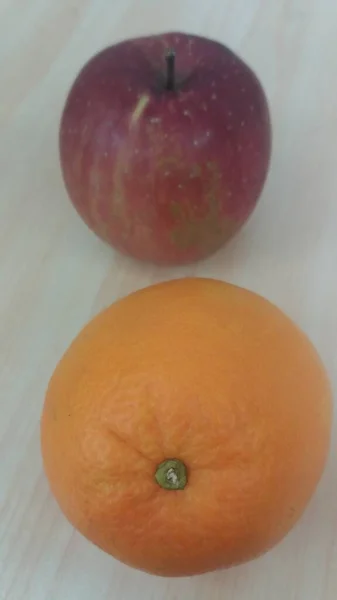 close up of a red apple on a white background