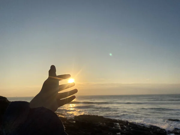 silhouette of a man with a heart on the beach