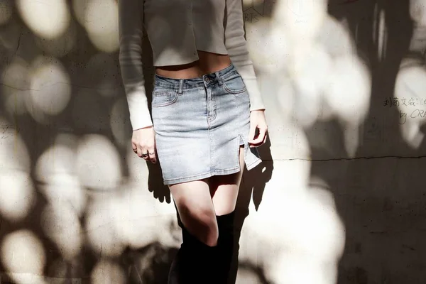 young woman in casual clothes posing in the city