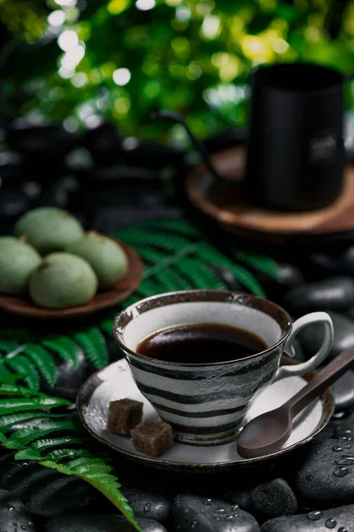 cup of coffee and green tea on a wooden table