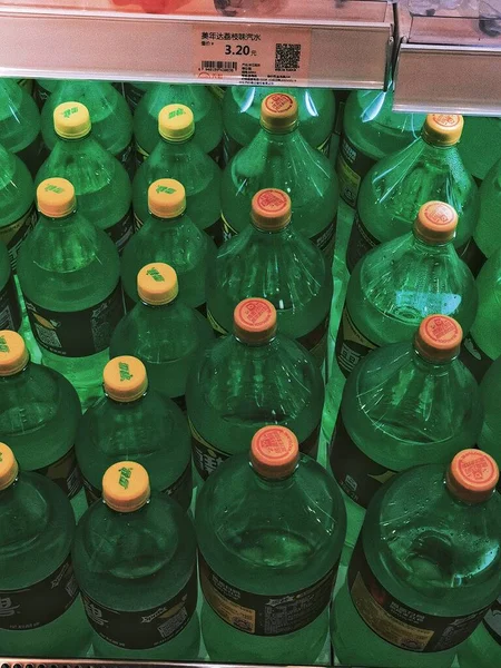 green beer bottles in the market