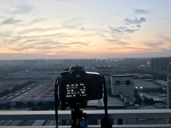 silhouette of a modern city with a camera