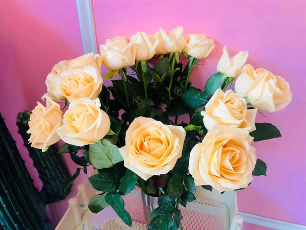 beautiful bouquet of roses in a vase on a white background