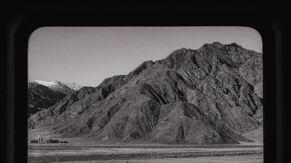 black and white photo of a mountain