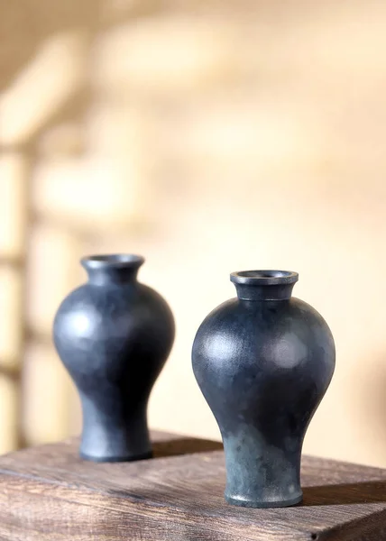 old wooden table with a glass vase