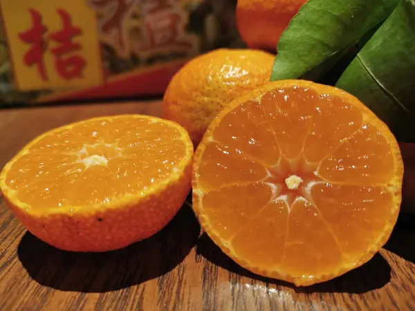 fresh orange and yellow fruit on wooden background