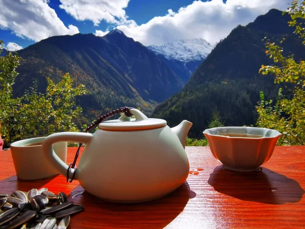 tea cup and coffee on the mountain background