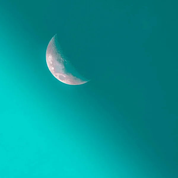 moon and sun on blue sky background