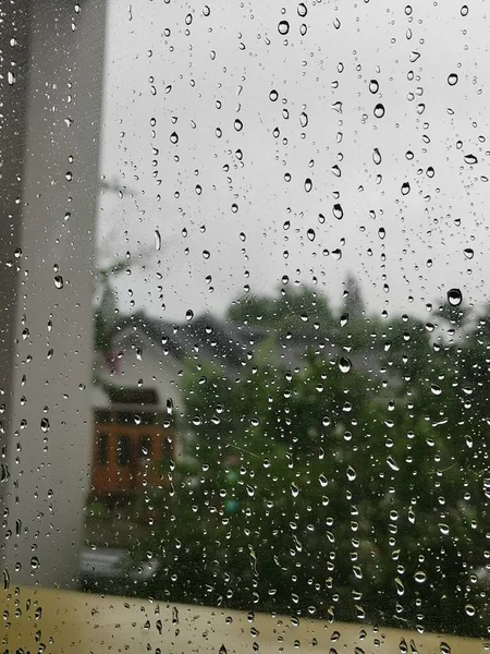 raindrops on glass window with rain drops on the windows