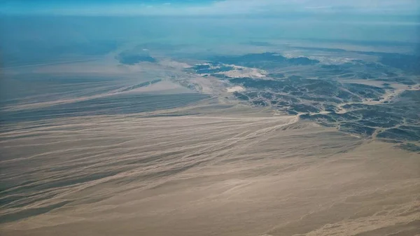 aerial view of the desert, the sky and the clouds