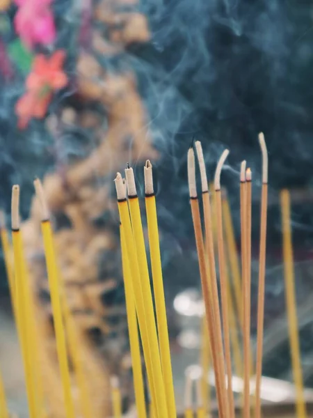 incense sticks on the background of the smoke