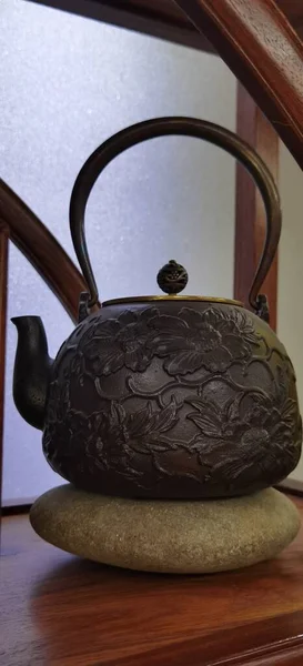 ceramic teapot and cup on the table