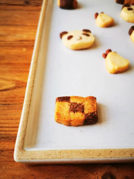 delicious homemade cookies with jam on wooden table