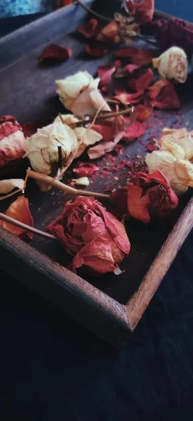 dried rose petals, roses and leaves