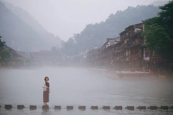 beautiful asian woman in the fog