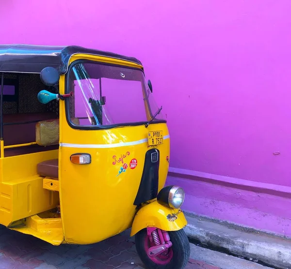 a yellow taxi car with a blue background