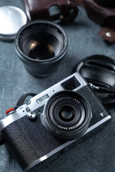 vintage camera with a photographic slr cameras on a wooden background.