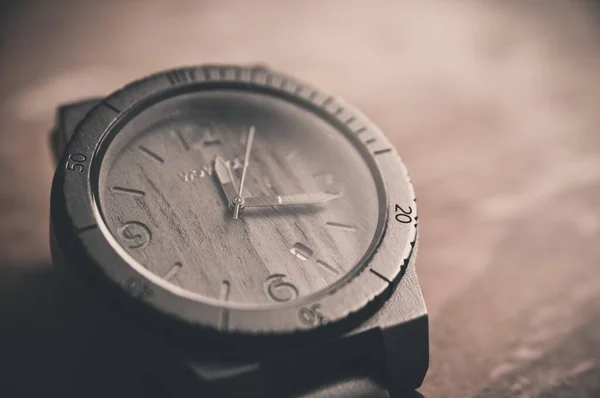 vintage watch on the old wooden background