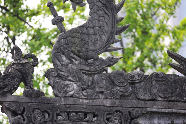stone carving of the dragon statue in the park
