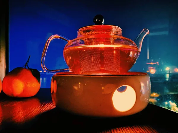 red tea with a kettle and a cup of coffee