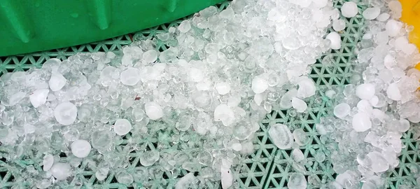 white salt crystals on a green background.