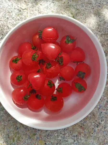 stock image red and white tomatoes in a bowl