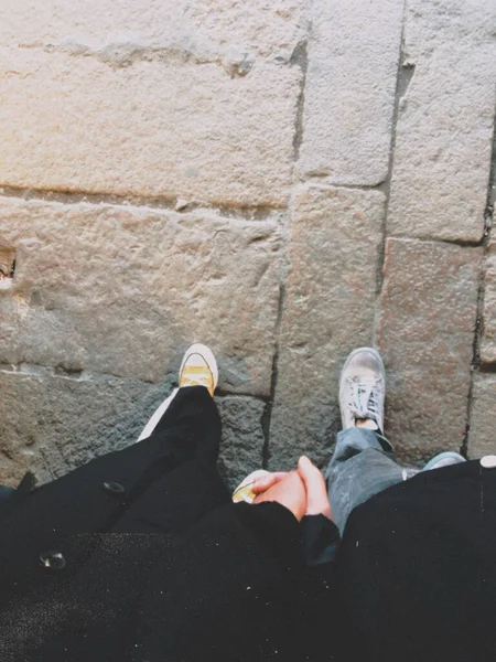 man in a suit with a backpack on the background of the old wall