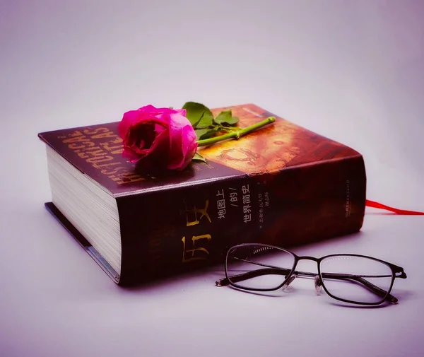 book and heart on a white background