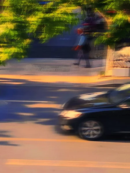 motion blur of a man riding a car