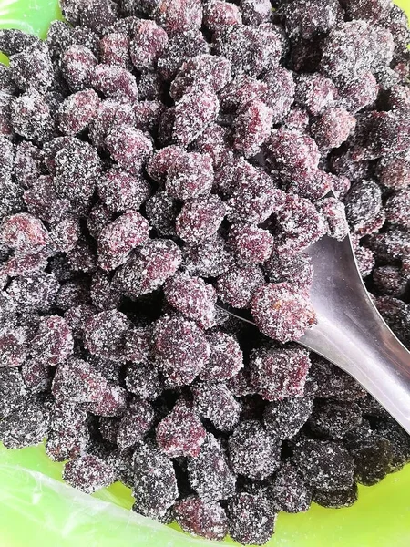 frozen fresh berries on a black background