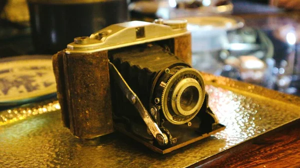 old vintage camera on the background of the wooden table