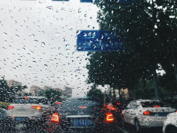 rainy weather, rain drops on the road