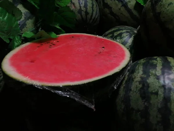 watermelon slices on a black background
