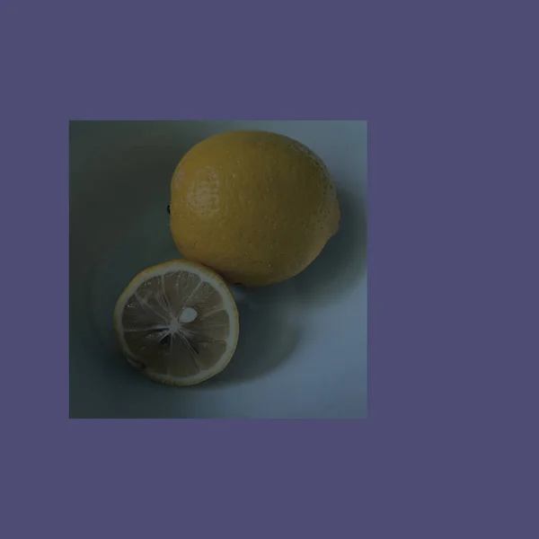 fresh lemon and half of a slice of a white background