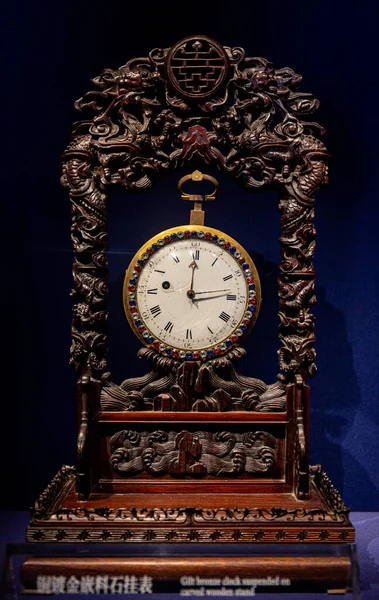 old clock on a black background