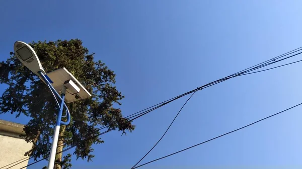 modern wireless antenna on blue sky background