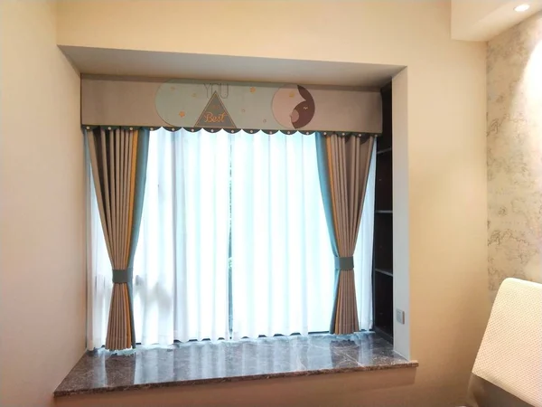 interior of a hotel room with curtains