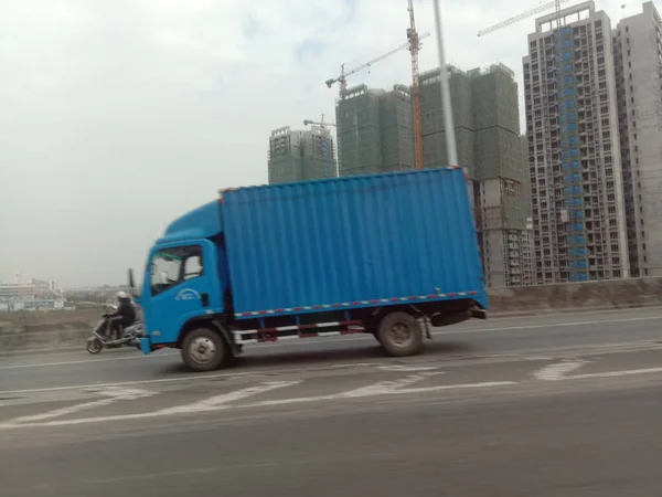 truck with cargo trucks on the road