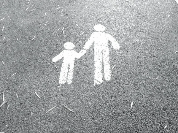 black and white figures of a family with a child