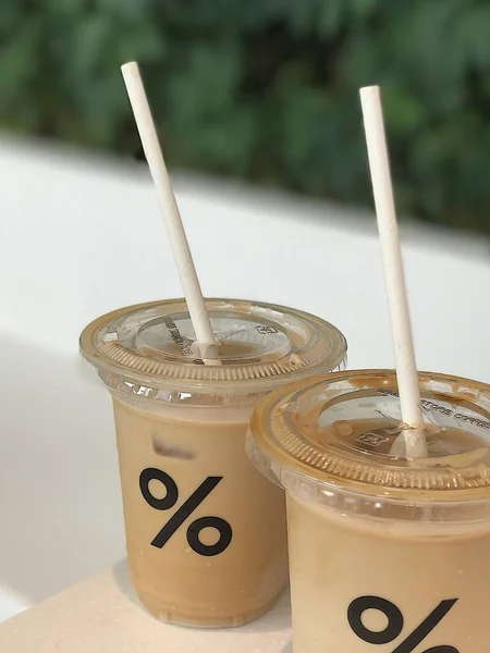iced coffee in a plastic cup on a white background