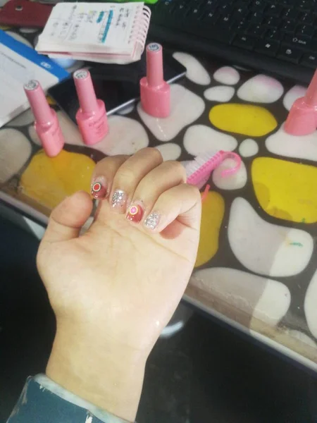manicure and pedicure. female hands with nail polish.