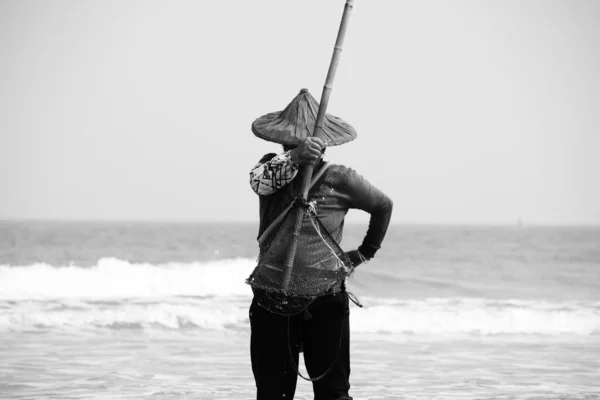 man with kite on the beach