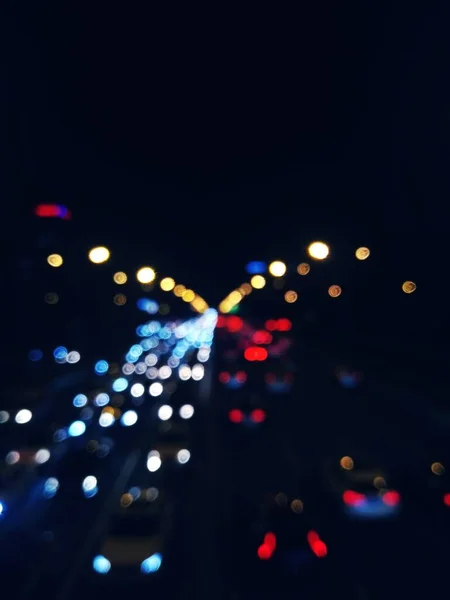 blurred bokeh background of city lights
