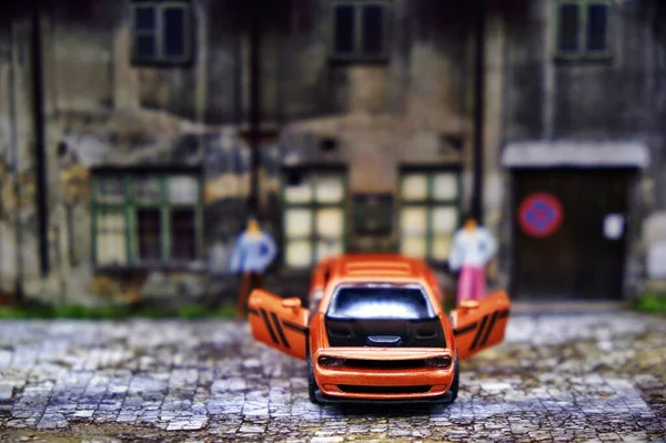 a small toy car on the street