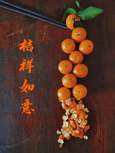 mandarin oranges and tangerines on a wooden background