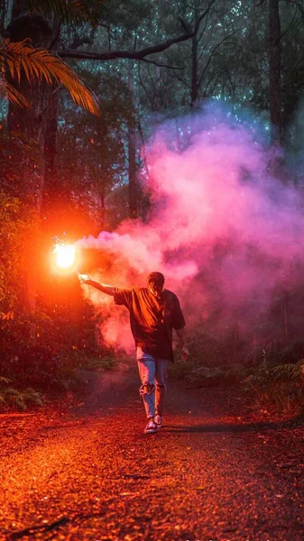 man with a sword in the forest