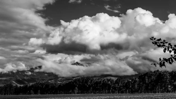 black and white clouds in the mountains